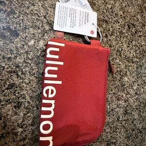 lululemon athletica rust red clippable card pouch